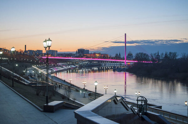 Tyumen, Russia, on April 15, 2020: A spring high water on the embankment in Tyumen in the evening.