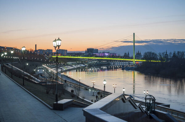 Tyumen, Russia, on April 15, 2020: A spring high water on the embankment in Tyumen in the evening.