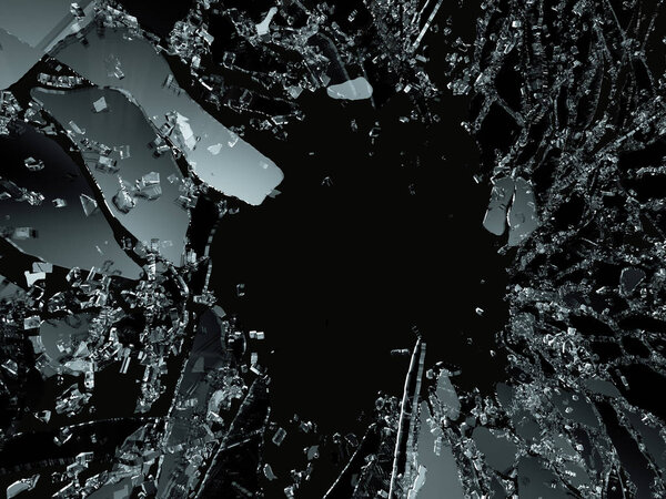 Pieces of splitted or cracked glass on black