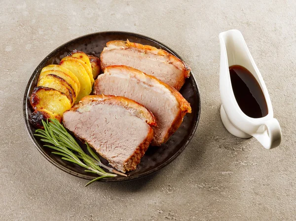 Roasted pork slices and potatoes — Stock Photo, Image