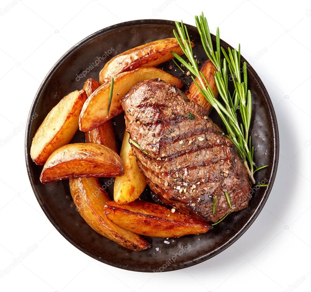 grilled beef steak and potatoes