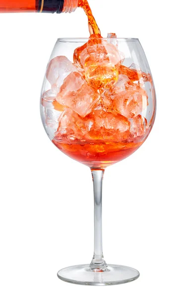 Red aperitif pouring into glass — Stock Photo, Image