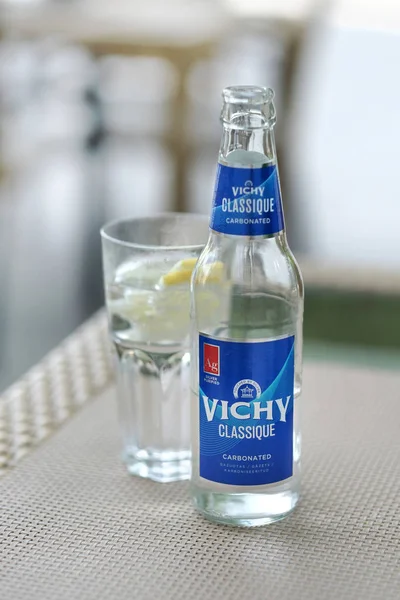 Carbonated water in glass bottle on the table — Stock Photo, Image