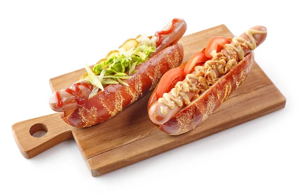 Two hotdogs on wooden cutting board — Stock Photo, Image