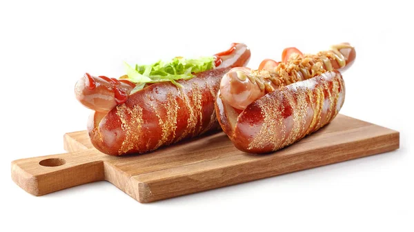Two hotdogs on wooden cutting board — Stock Photo, Image
