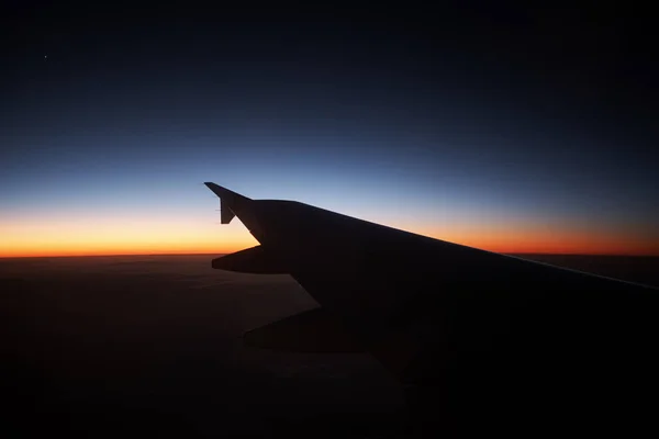 Sonnenuntergang aus dem Flugzeug Stockbild