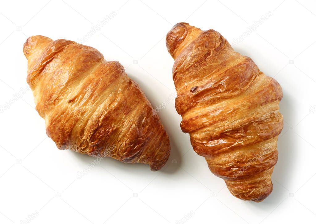 freshly baked croissants isolated on white background, top view