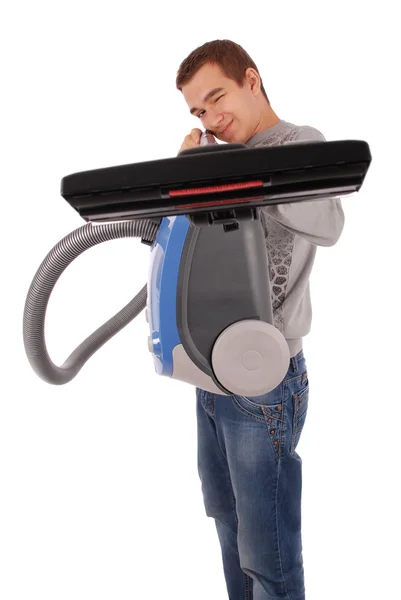 Boy holding a vacuum cleaner and takes aim — Stock Photo, Image