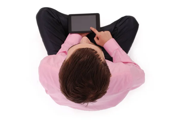 Boy in pink shirt sit and hold tablet PC — Stock Photo, Image