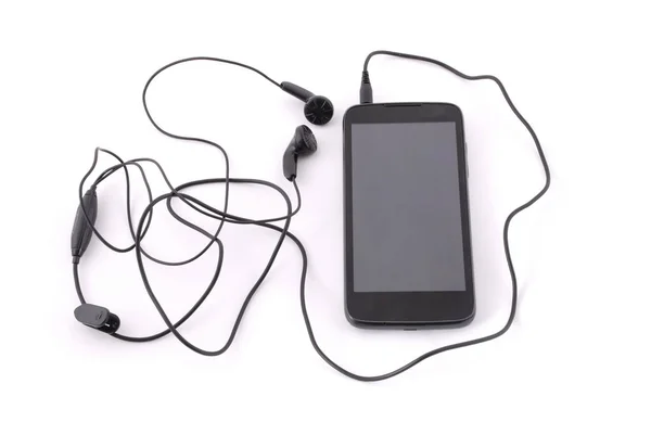 Smartphone y auriculares — Foto de Stock