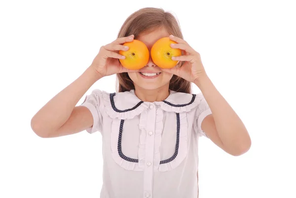 Menina com laranjas nos olhos — Fotografia de Stock