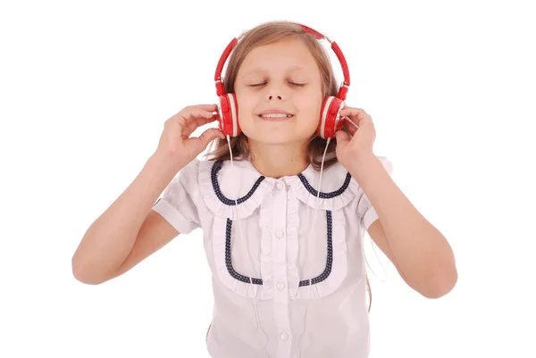 Glückliches junges Mädchen hört Musik — Stockfoto