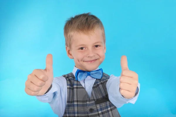 Schoolboy showing two thumbs up — Stock Photo, Image