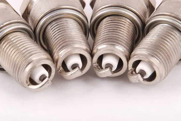 Four new spark plugs — Stock Photo, Image