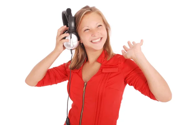 Chica encantadora escuchando una música con auriculares — Foto de Stock