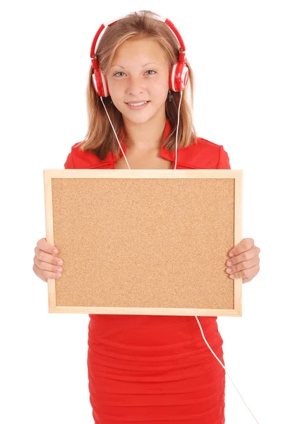 Nastoletnie dziewczyny w słuchawkach, trzymając pokładzie korka — Zdjęcie stockowe