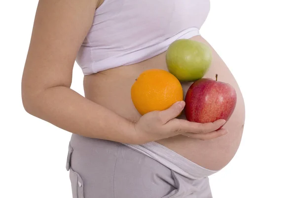 Mujer embarazada con frutas (camino de recorte ) — Foto de Stock