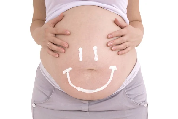 Vientre mujer embarazada. Cuidado de la piel del vientre embarazada (Clipping Pat Imagen de stock
