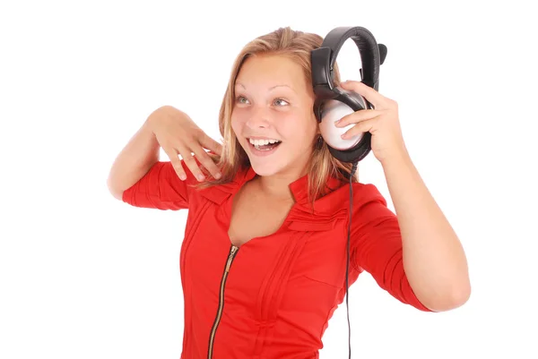 Vakker jente som lytter til musikk med hodetelefoner – stockfoto