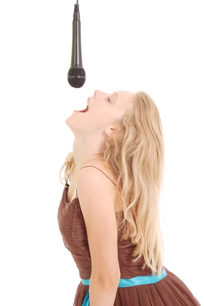 Happy young beautiful girl singing with microphone — Stock Photo, Image