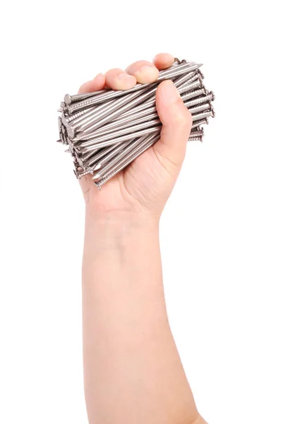 Man's hand holding metal nails (Clipping path) — Stock Photo, Image