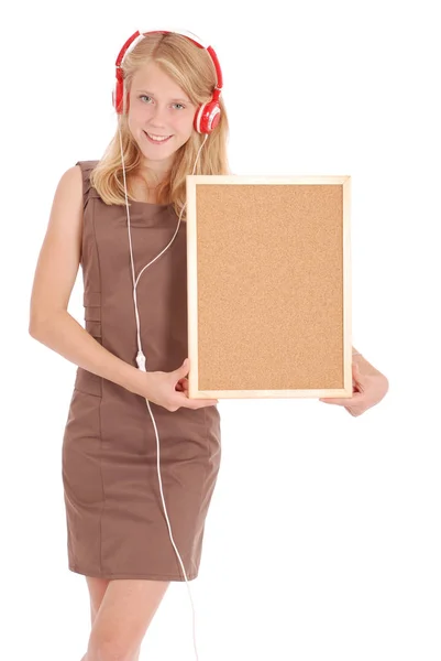 Adolescente en auriculares, sujetando el tablero de corcho —  Fotos de Stock