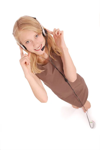 Hermosa chica estudiante operador de servicio al cliente con auriculares —  Fotos de Stock