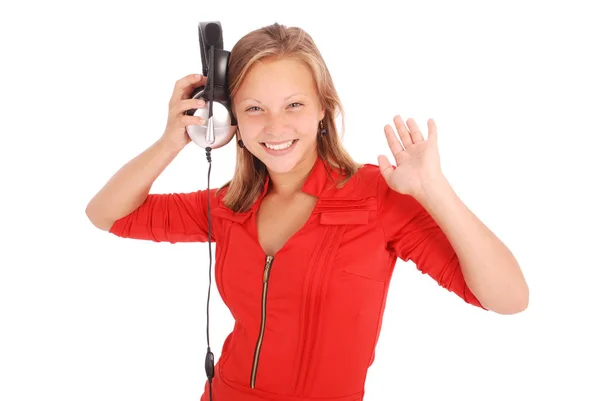 Chica encantadora escuchando una música con auriculares — Foto de Stock