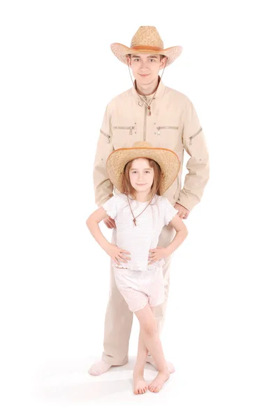 Brother and sister in cowboy hats — Stock Photo, Image