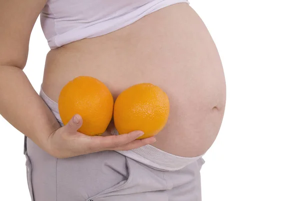 Pregnant woman with orange (Clipping path) — Stock Photo, Image