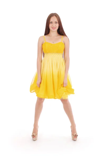 Adolescente chica es de pie espalda vestido amarillo . —  Fotos de Stock