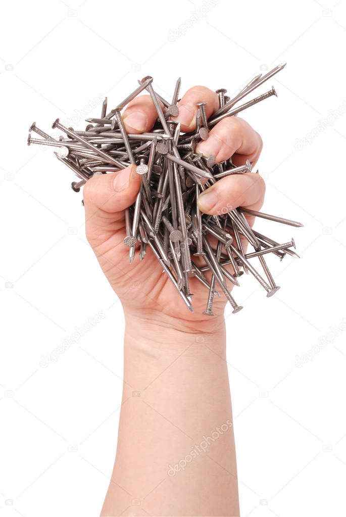 Man's hand holding metal nails (Clipping path)