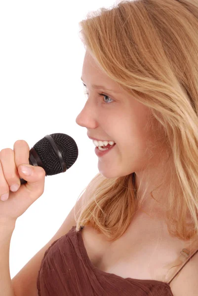 Hermosa chica adolescente con micrófono — Foto de Stock