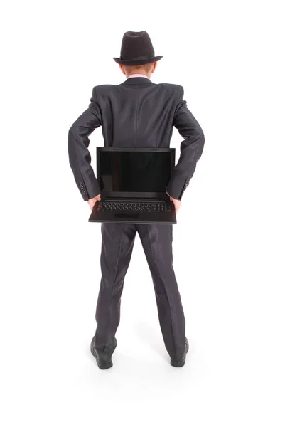 Homme en costume noir avec un ordinateur portable — Photo