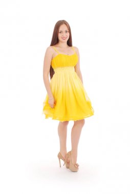 Genç kız elbise geri sarı ayakta olduğunu.