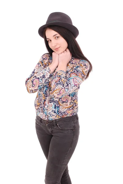 Beautiful young girl in black hat on his head — Stock Photo, Image