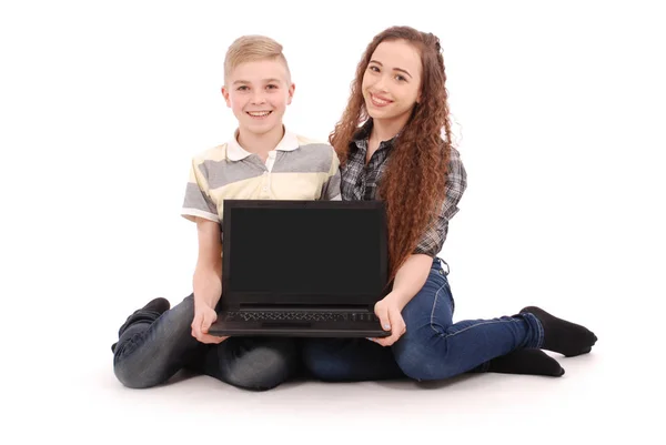 Boy and girl using a laptop isolated — Stock Photo, Image