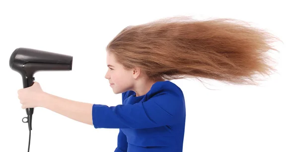 Young girl using hairdryer Stock Image
