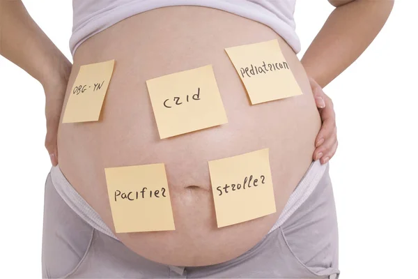 Těhotné břicho a nálepka poznámky (Ořezová cesta) — Stock fotografie