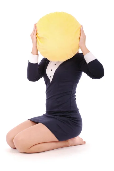 Young girl is holding a smiley face pillow — Stock Photo, Image