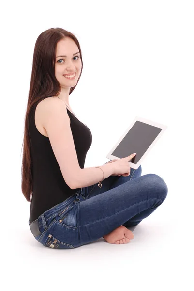 Happy student teenage girl sitting sideways on the floor with ta — Stock Photo, Image