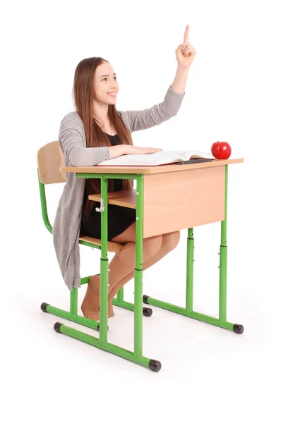Teenager school girl raising hand to ask question — Stock Photo, Image