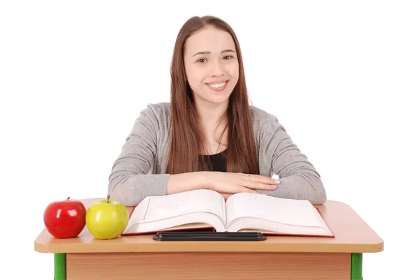 Ecole fille assis à un bureau — Photo