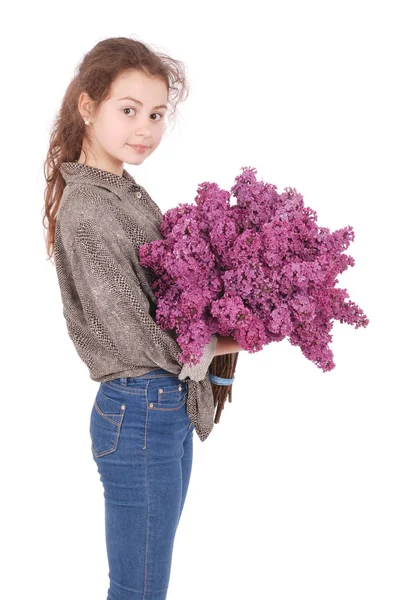 Girl teenager standing with lilac in hands — Stock Photo, Image