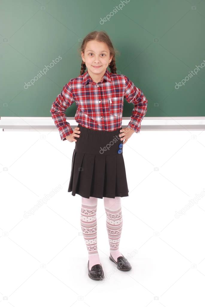 Girl is standing in front school board