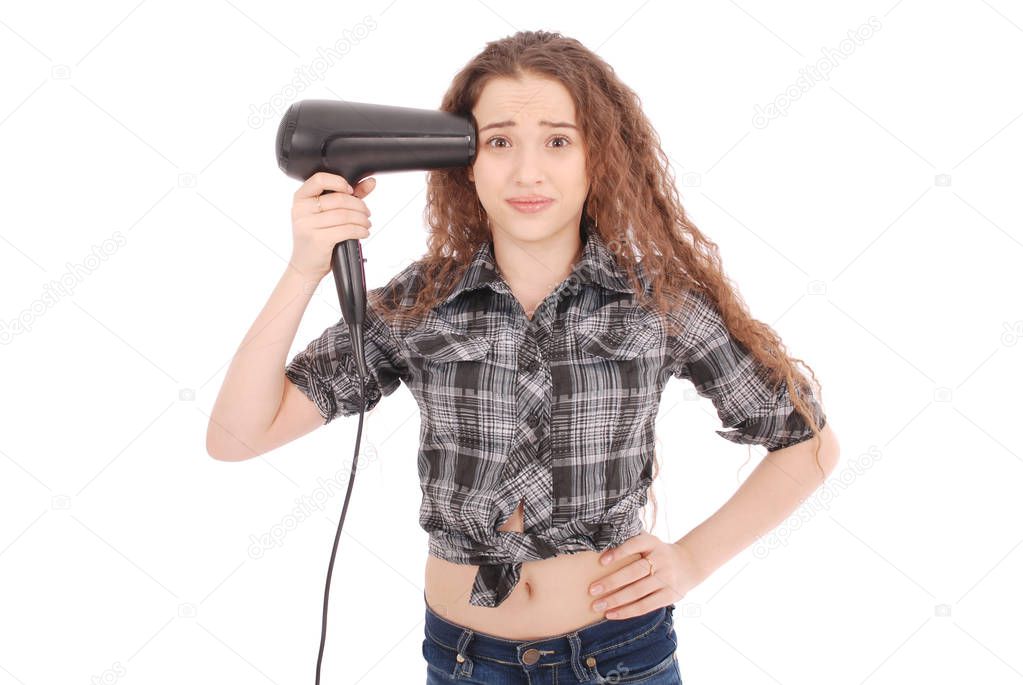 Young girl using hairdryer