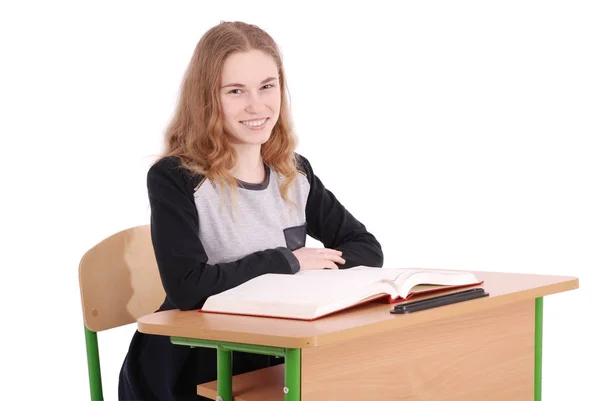 School girl sitting at a desk — Stock Photo, Image