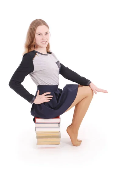 Education, people, teenager and school concept - teenager school girl sitting on stack — Stock Photo, Image