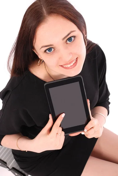 Happy student teenage girl sitting on the ladder and showing a t — Stock Photo, Image
