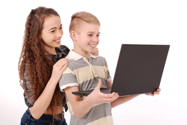 Boy and girl using a laptop isolated — Stock Photo, Image